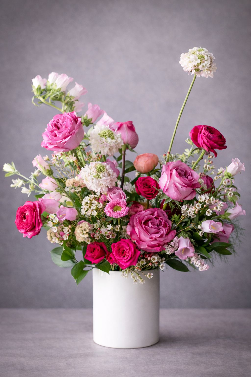 Professional florist arranging premium flowers